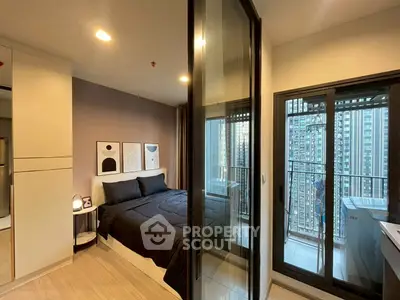 Modern bedroom with balcony view in high-rise apartment