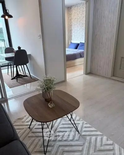 Modern apartment interior with stylish living room and cozy bedroom view.