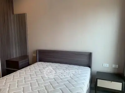 Cozy bedroom with modern furniture and comfortable mattress in a stylish apartment.