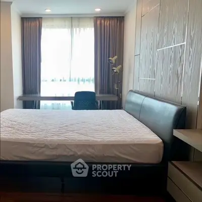 Modern bedroom with sleek design and ample natural light