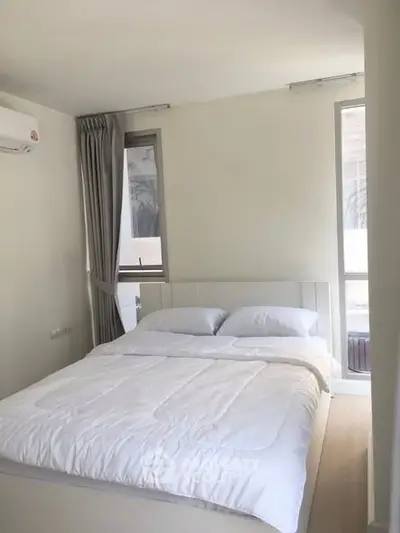 Bright and cozy bedroom with natural light and modern decor