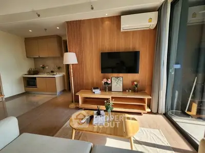 Modern living room with wooden accents and open kitchen layout