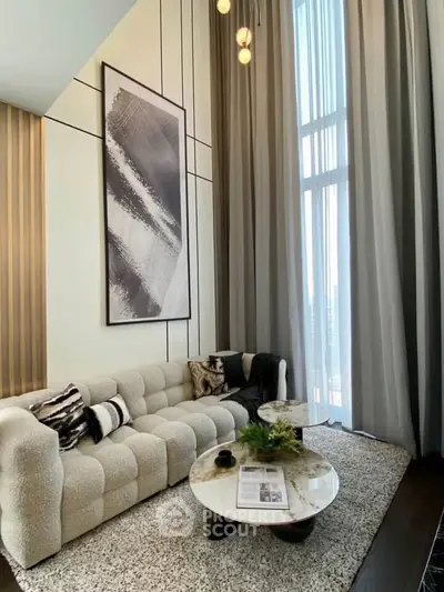 Luxurious modern living room with high ceilings and elegant decor