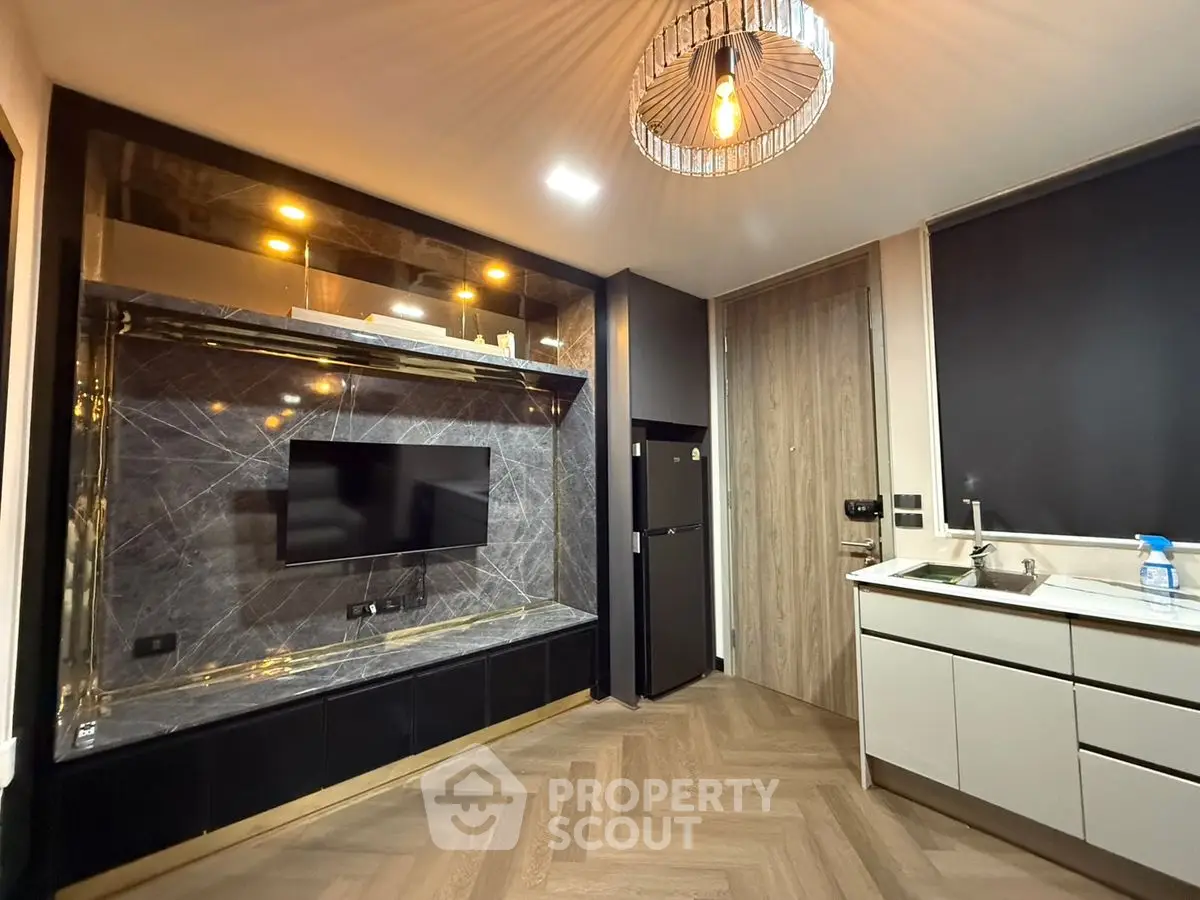 Modern living room with sleek TV unit and stylish lighting