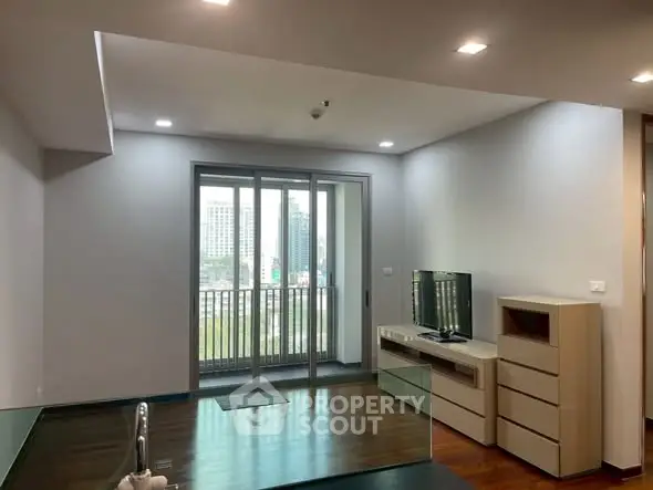 Modern living room with balcony view in urban apartment