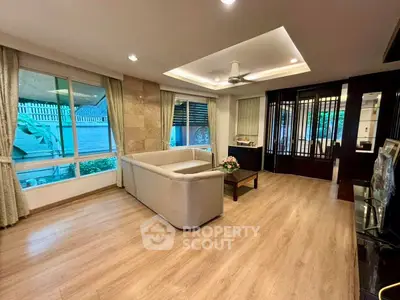 Spacious living room with modern design and large windows for natural light