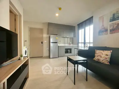 Modern living room with sleek kitchen, cozy sofa, and natural light from large windows.