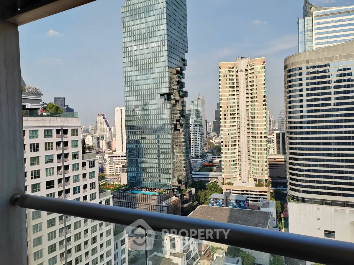 Stunning cityscape view from a high-rise balcony showcasing modern skyscrapers and urban skyline.