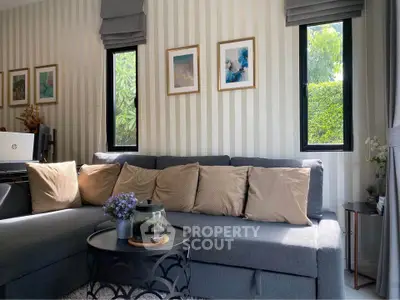 Chic living room with stylish decor and natural light, perfect for relaxation and entertaining.