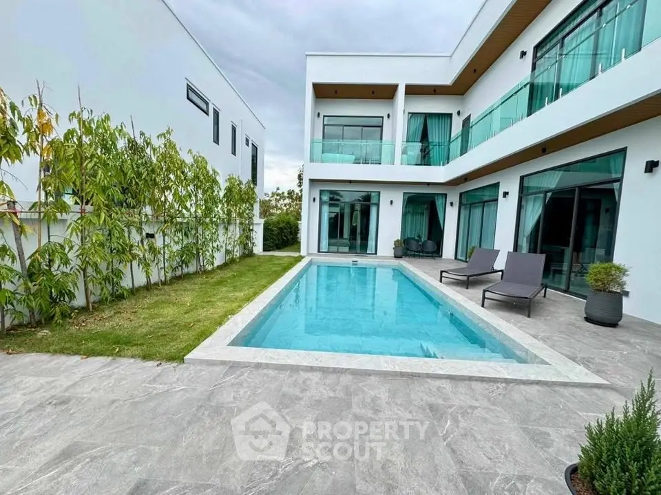Luxurious modern villa with private pool and spacious outdoor area, perfect for relaxation and entertainment.