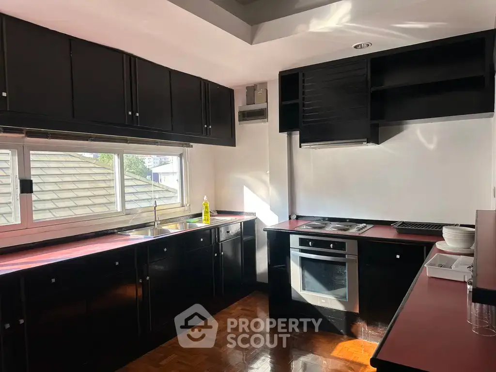 Spacious kitchen with modern appliances and ample natural light