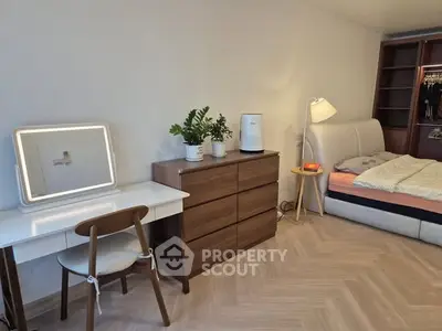 Modern bedroom with stylish furniture and cozy lighting