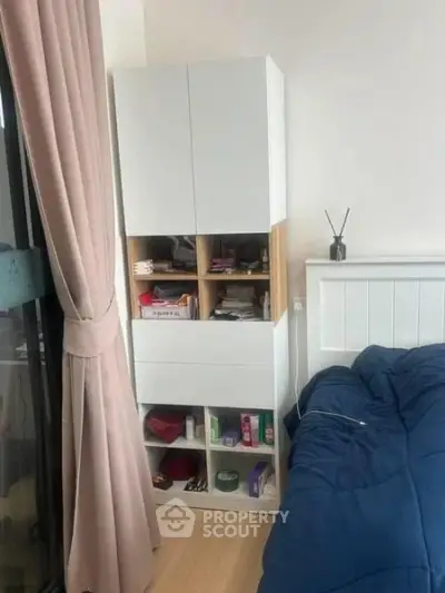 Cozy bedroom with modern storage cabinet and stylish decor