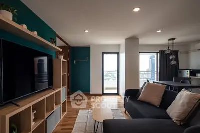 Modern living room with stylish decor and city view balcony, perfect for urban living.