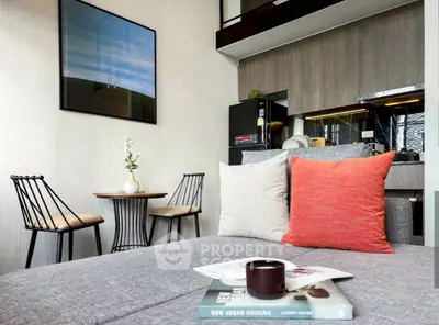 Modern living room with stylish decor and open kitchen layout, perfect for urban living.