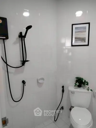 Modern bathroom with sleek shower and elegant decor, perfect for a contemporary home.
