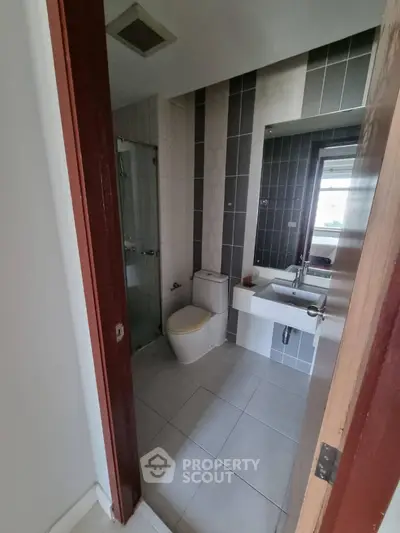 Modern bathroom with sleek design and glass shower enclosure