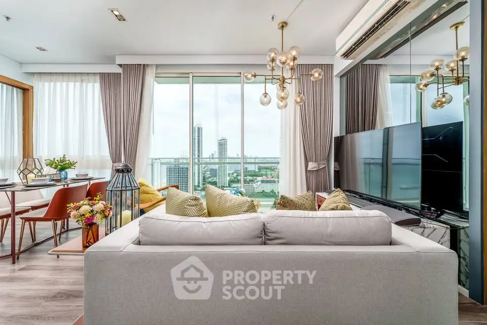 Luxurious living room with modern decor and stunning city view from large windows.