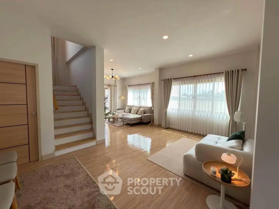 Spacious modern living room with elegant decor and natural light