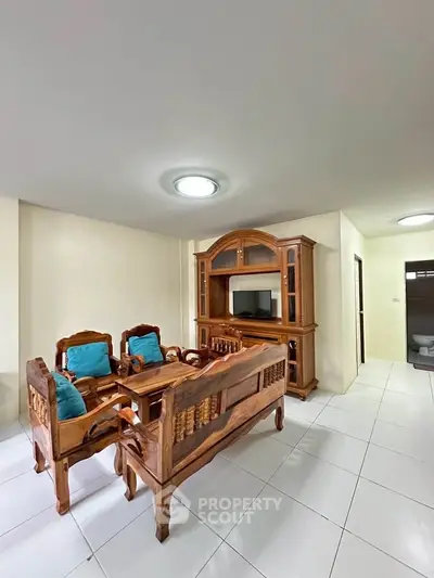 Spacious living room with elegant wooden furniture and bright lighting