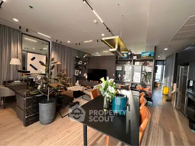 Modern open-plan living room with stylish decor and dining area