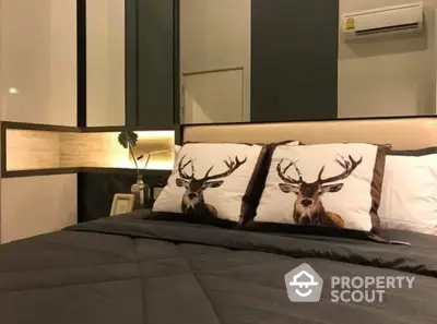 Cozy modern bedroom with stylish deer-themed bedding, elegant dark tones, and ambient lighting creating a tranquil atmosphere.