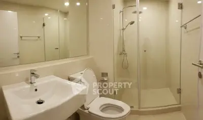 Modern bathroom with glass shower and sleek fixtures