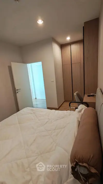 Cozy bedroom with modern decor and ample storage space