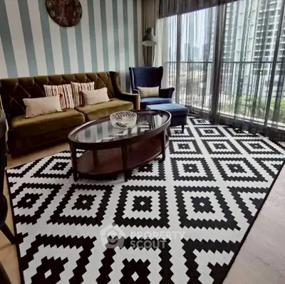 Stylish living room with modern decor and large windows offering city views.