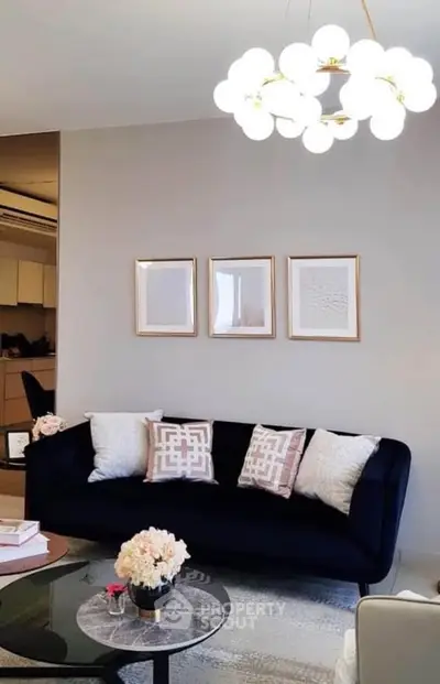 Elegant living room with modern chandelier and stylish decor