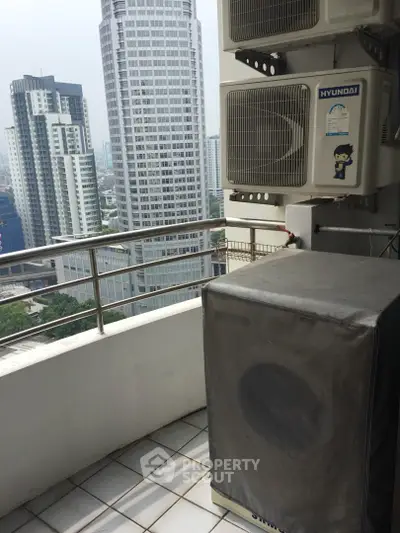 High-rise balcony with city view and air conditioning units, perfect for urban living.