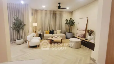 Stylish modern living room with elegant decor and cozy seating area.