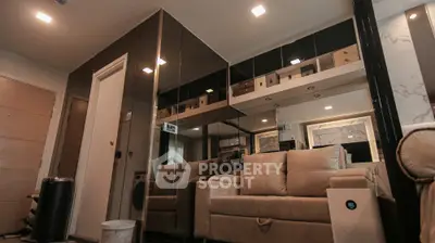 Modern living room with stylish mirrored walls and cozy beige sofa