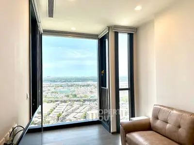 Modern living room with panoramic city view and stylish leather sofa