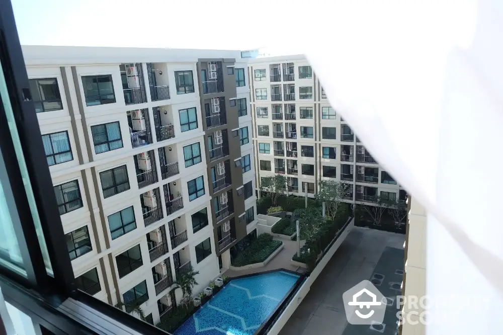 Modern apartment complex with swimming pool view from window