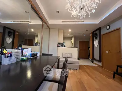 Elegant living room with chandelier and wooden flooring