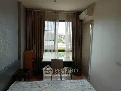 Cozy bedroom with natural light and modern furnishings