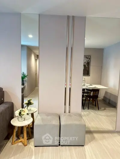 Modern living room with stylish decor and elegant dining area