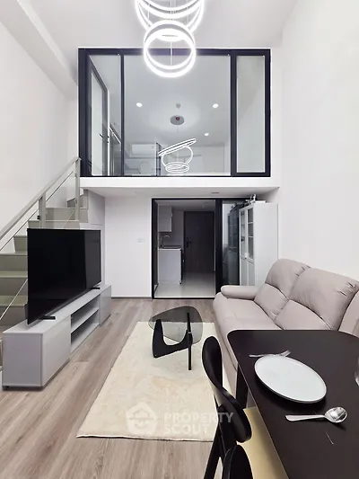 Modern loft apartment with stylish living room and mezzanine bedroom