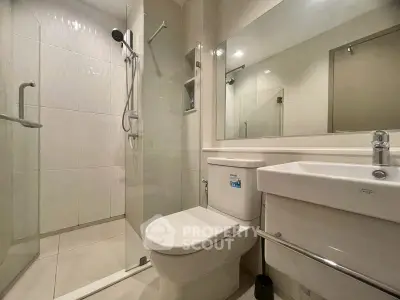 Modern bathroom with glass shower and sleek fixtures