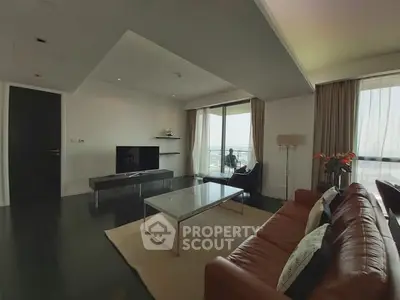 Luxurious modern living room with sleek furniture and stunning city view.