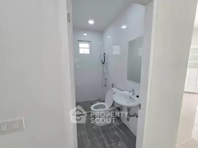 Modern bathroom with sleek design and minimalist fixtures in a bright, airy space.