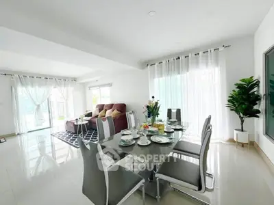 Spacious modern living and dining area with elegant decor and natural light