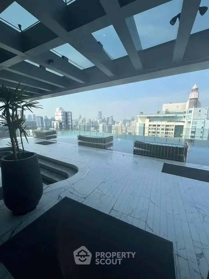 Stunning rooftop view with city skyline and modern glass architecture.