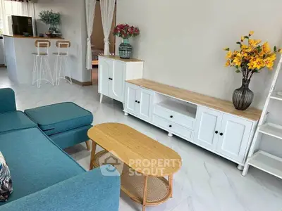 Stylish living room with modern furniture and open kitchen layout