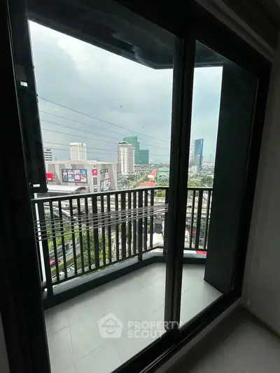Modern apartment balcony with city view, perfect for urban living.