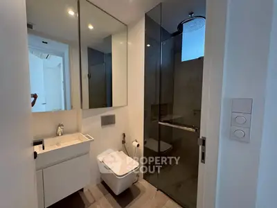 Modern bathroom with sleek design and glass shower enclosure