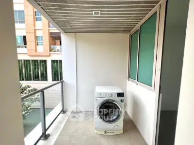 Modern balcony with washing machine in a stylish apartment complex