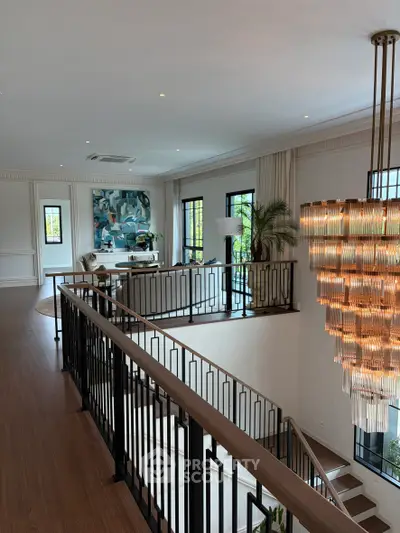 Luxurious living room with elegant chandelier and modern decor