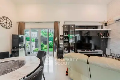 Spacious living room with modern decor and garden view
